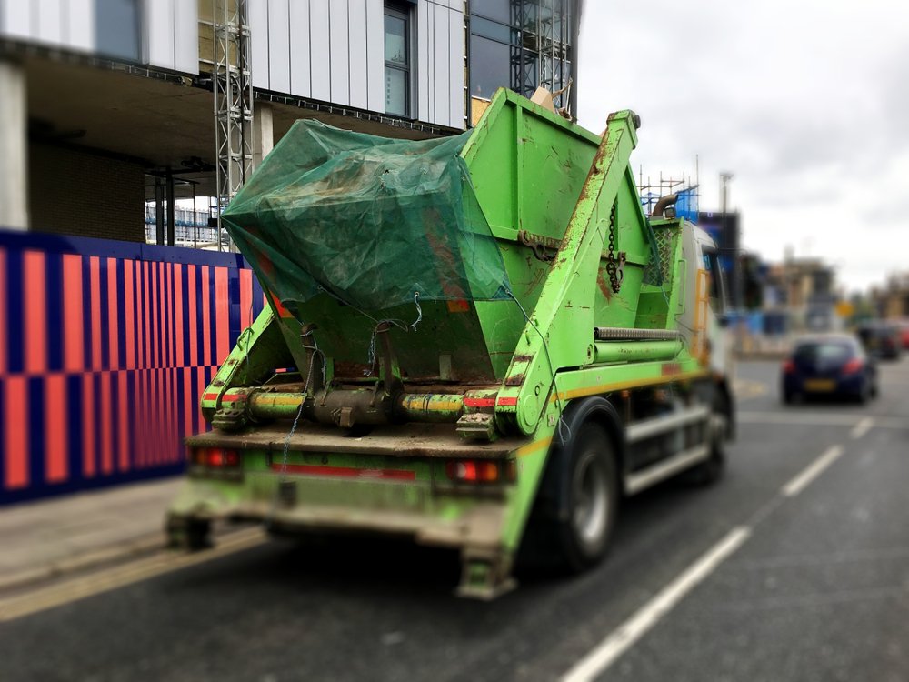Green,Industrial,Skip,With,Sheet,Cover,Top,,Loaded,Securely,On